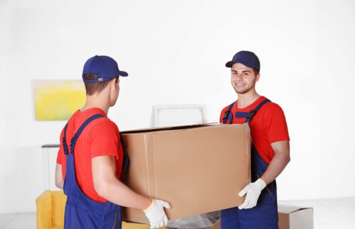 Student packing boxes for storage in Coombe