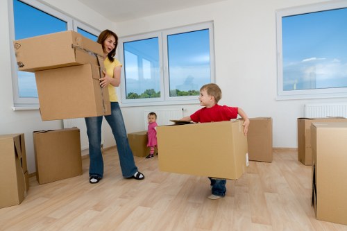 Loading furniture into a van for transport in Coombe